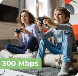 Image says, "300 megabits per second" and is an image of two children smiling and playing video games.