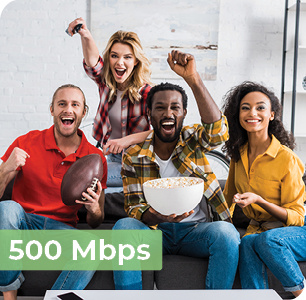 Image says, "500 megabits per second" and has an image of a diverse group of young adults smiling and cheering as they watch a football game on TV