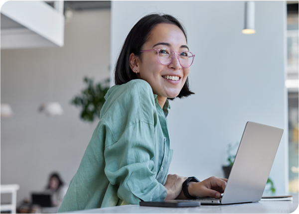 smiling businesswoman on computer